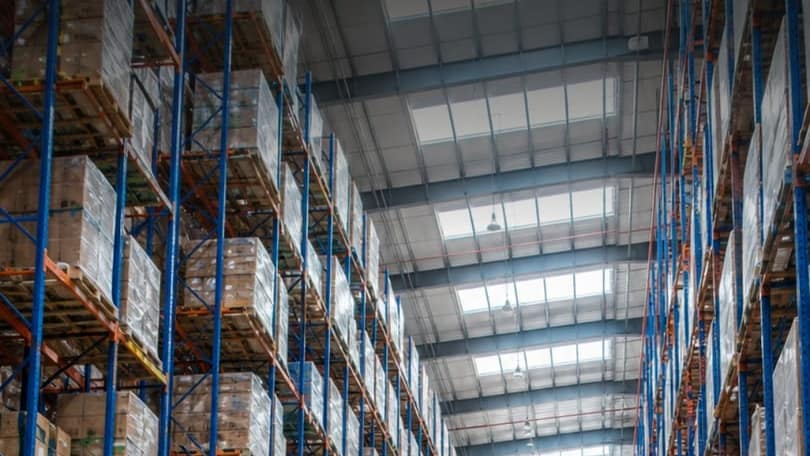 Distribution warehouse with tall racks full of pallets